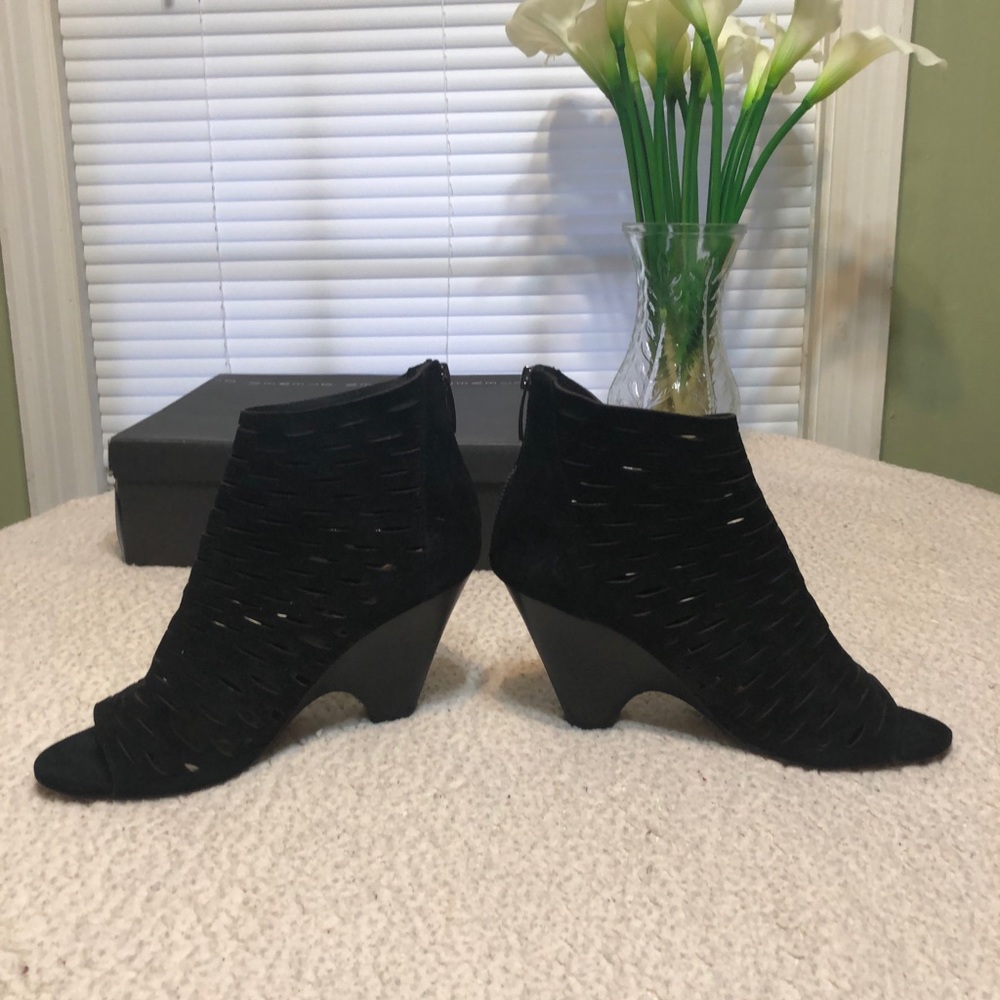 Black suede boots. Has small cutout squares.